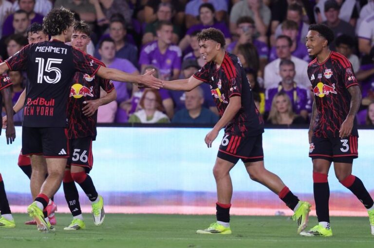 Red Bull New York teammates Adri Mehmeti and Julian Hall celebrate during the season-opening victory against Orlando City SC.