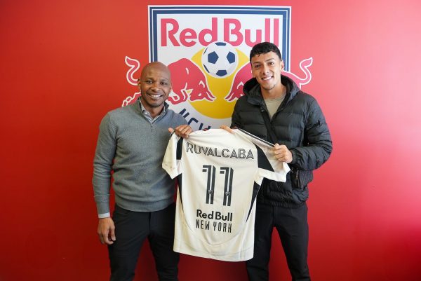 Red Bull New York head of sport Julian de Guzman stands with winger Jorge Ruvalcaba.