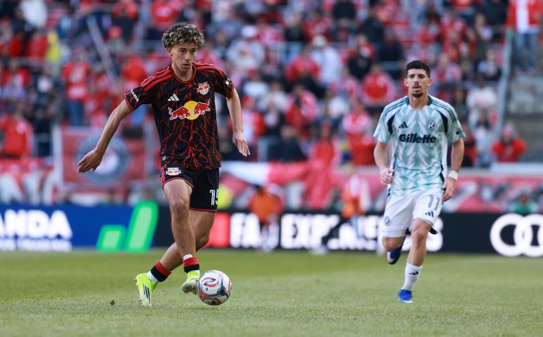 Red Bull New York midfielder Adri Mehmeti dribbles against the New England Revolution.