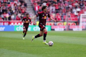Red Bull New York winger Cade Cowell dribbles the ball at Sports Illustrated Stadium.