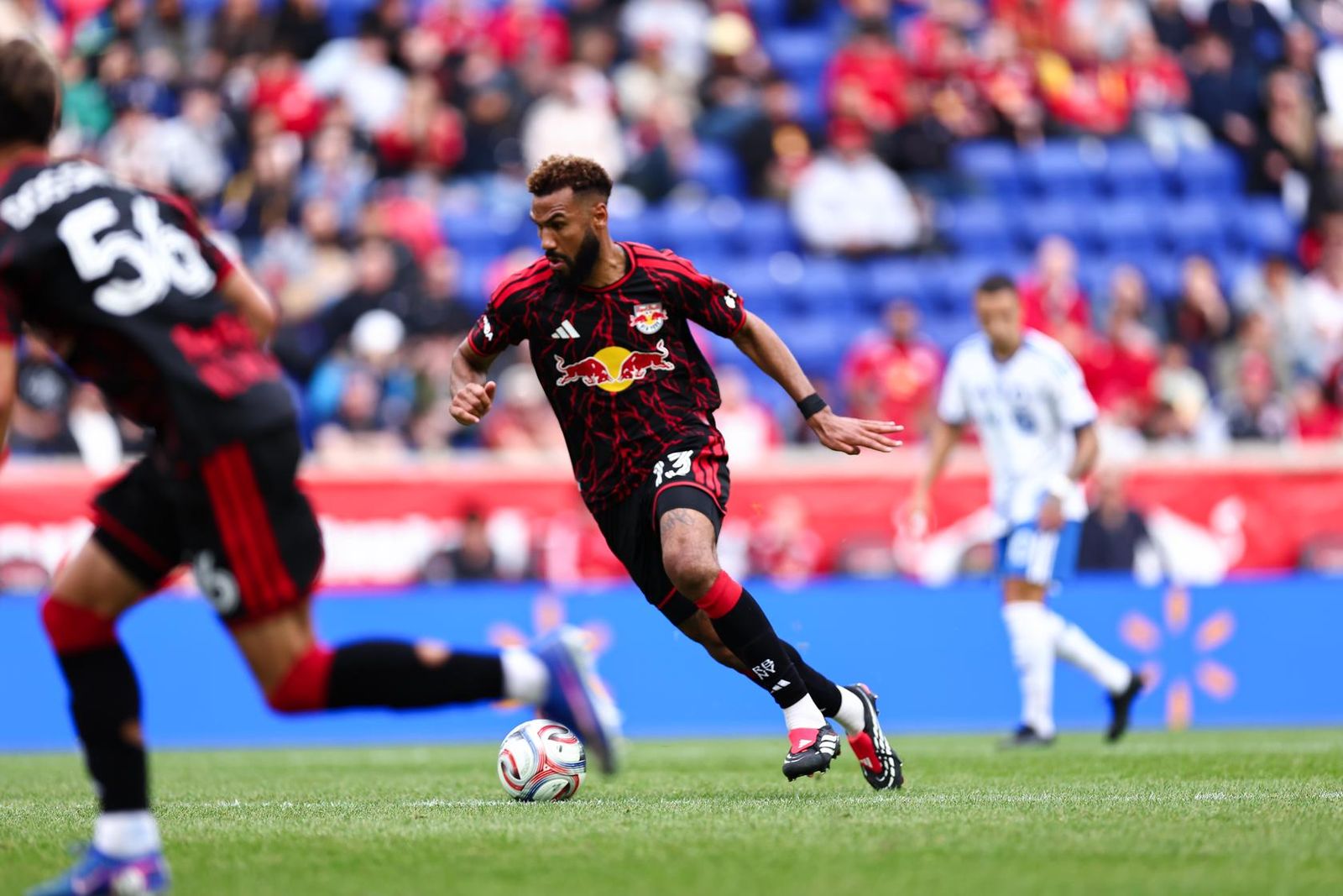Red Bull New York forward Eric Maxim Choupo-Moting dribbles the ball.
