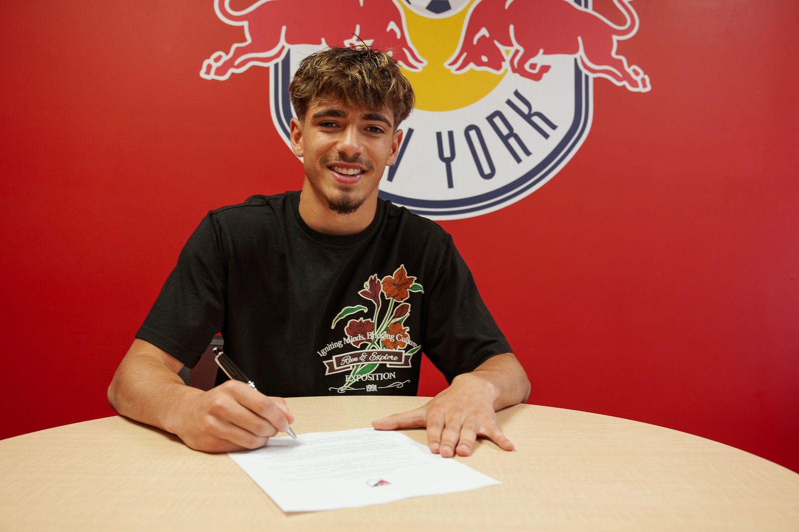 Matthew Dos Santos signs his first MLS contract with Red Bull New York.