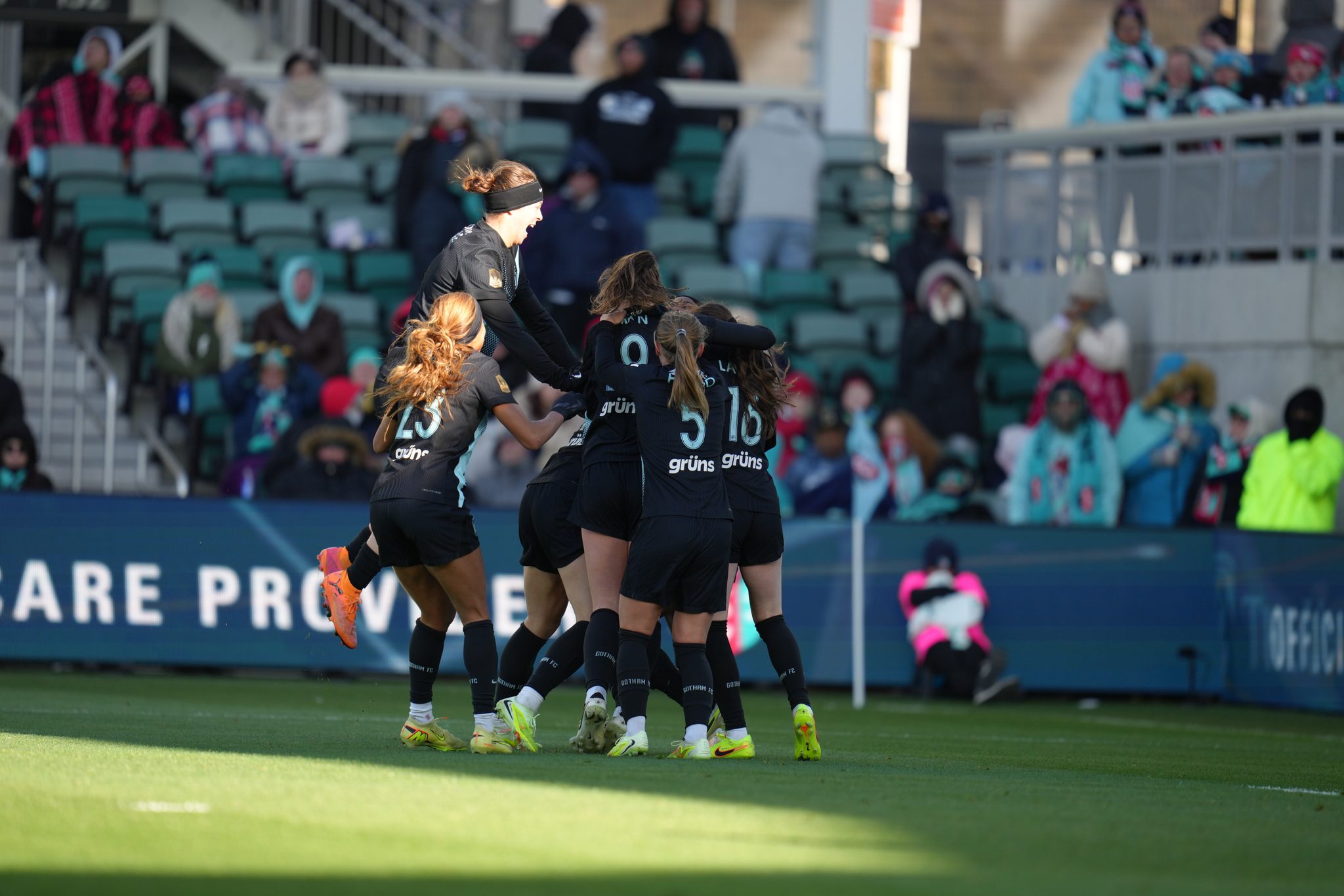 Gotham FC teammates celebrate during the 2025 NWSL playoff quarterfinal victory over the Kansas City Current.