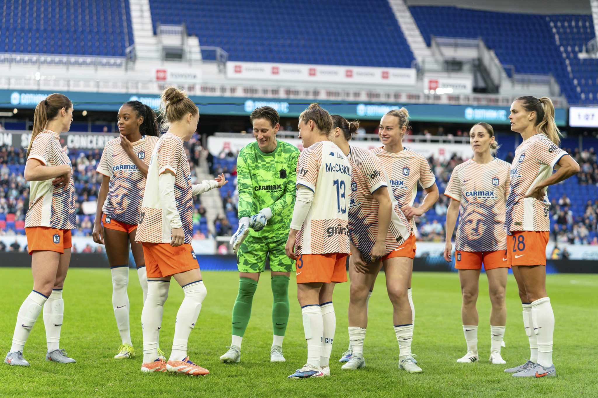 Gotham FC players gather before a match.