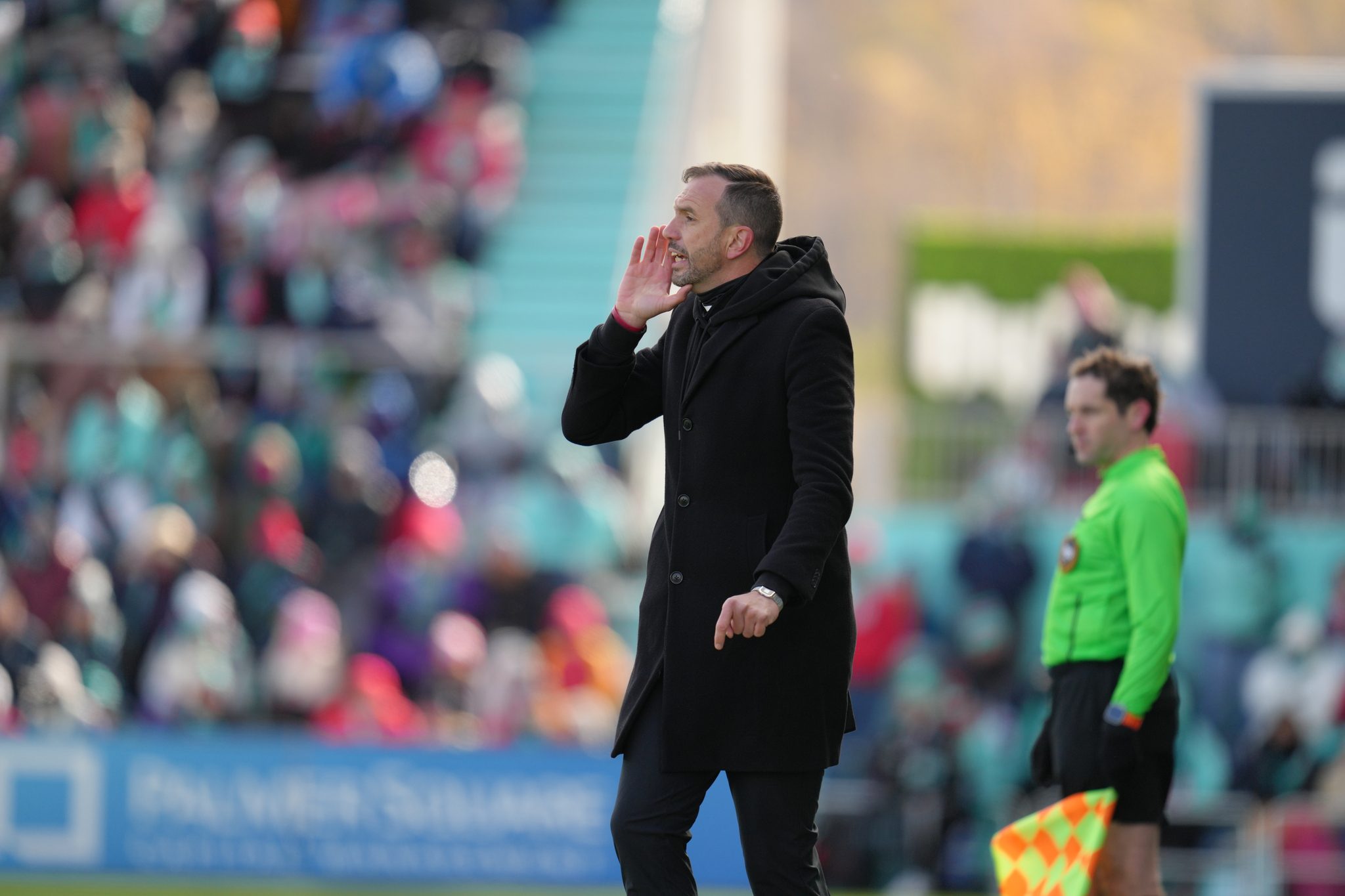 Gotham FC head coach Juan Carlos Amorós instructs his players from the technical area.