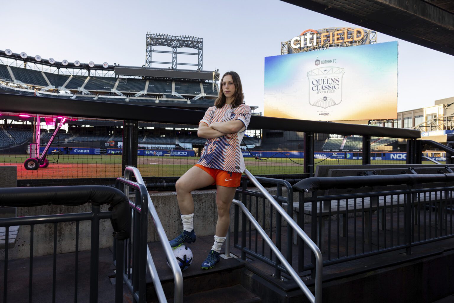Gotham FC defender Lilly Reale stands at the home dugout at Citi Field.
