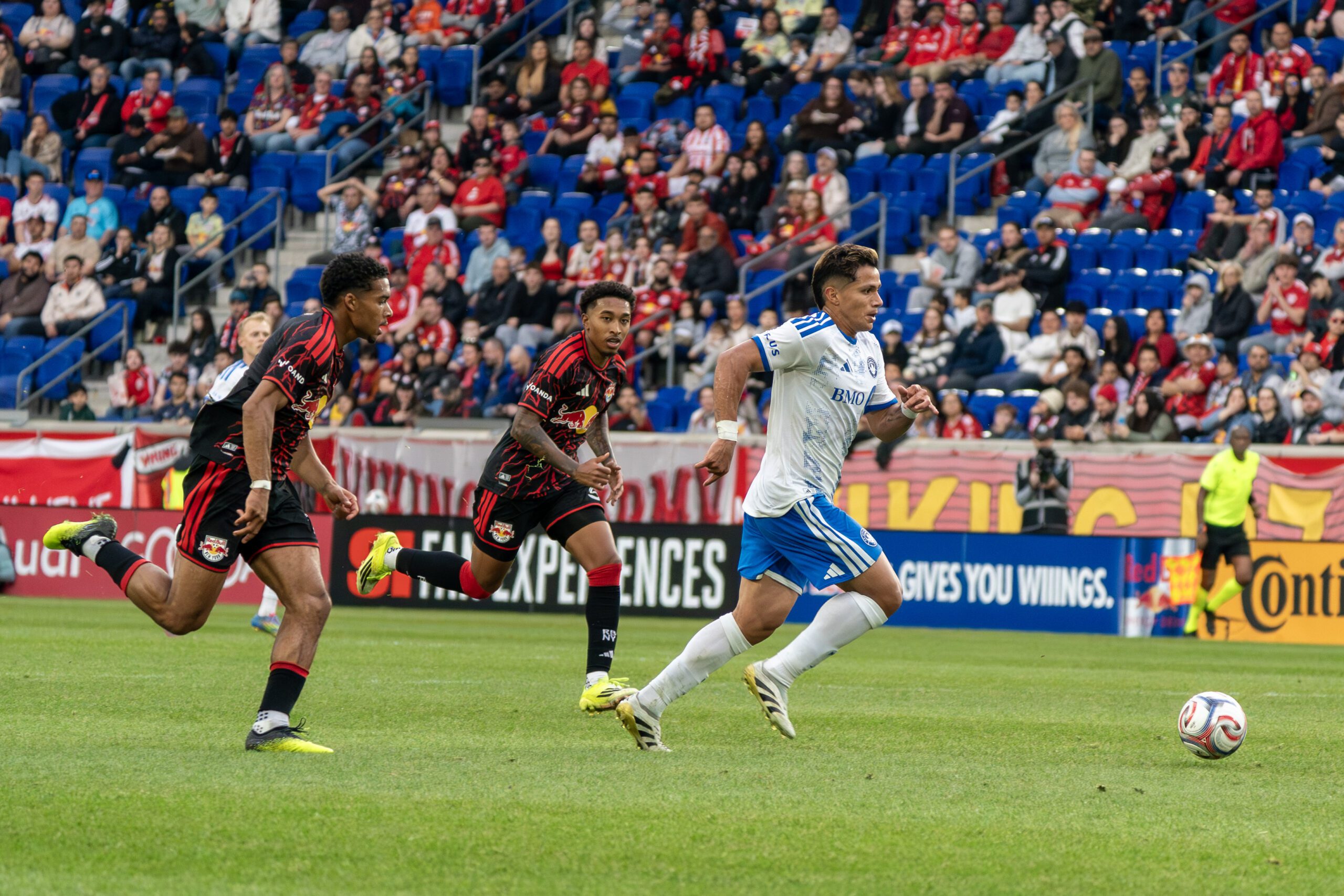 CF Montréal winger Wiki Carmona dribbles the ball against Red Bull New York at Sports Illustrated Stadium.