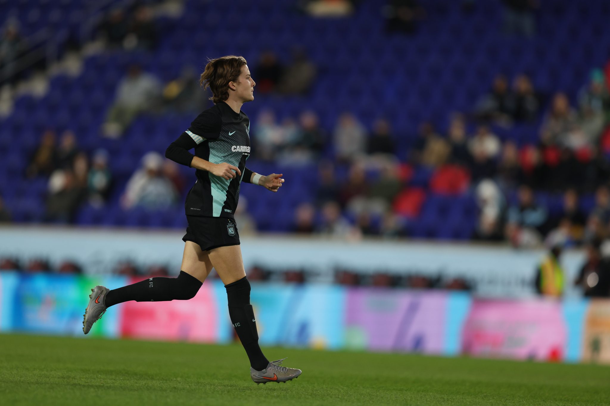 Gotham FC captain Tierna Davidson races across the pitch.