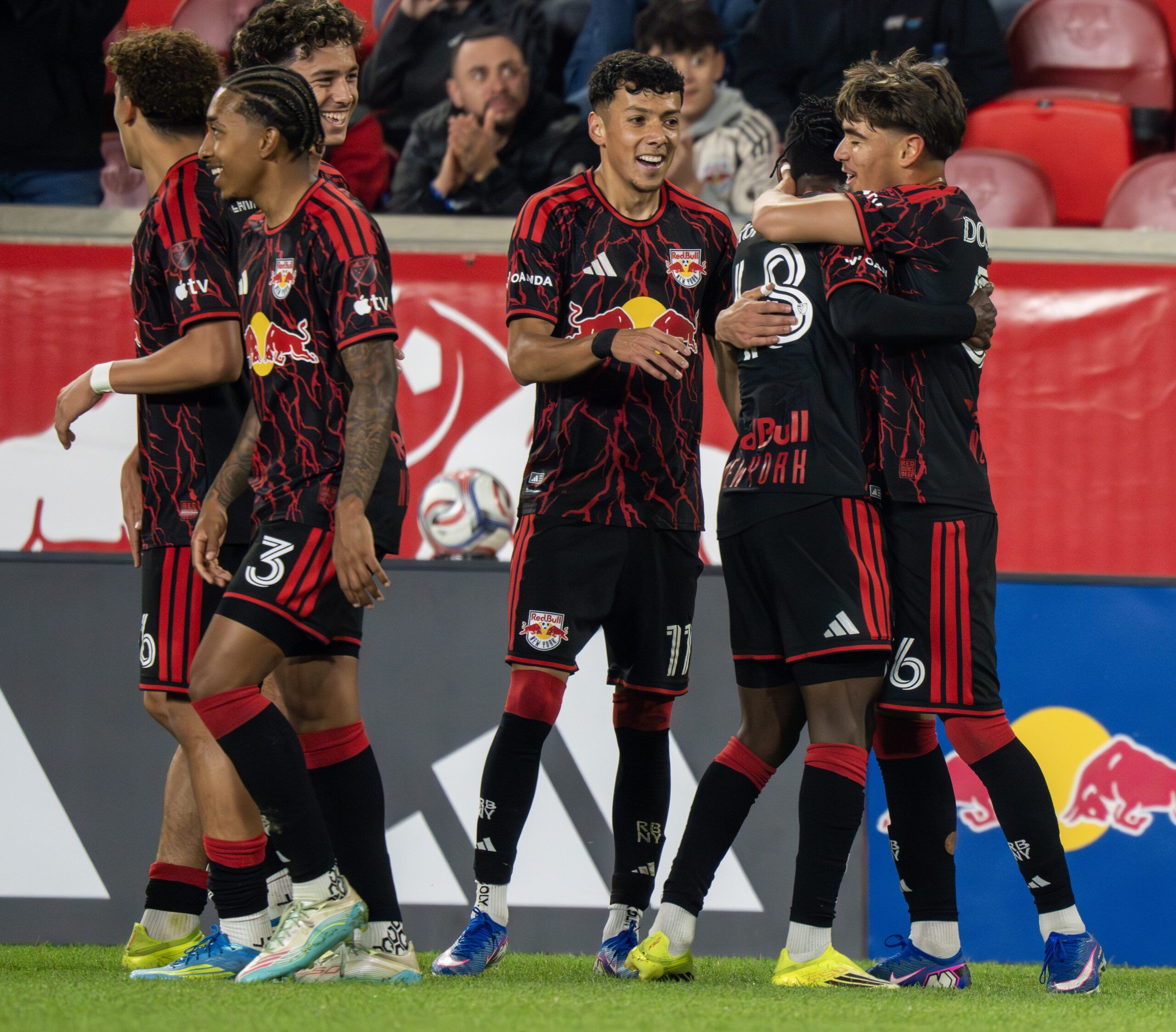 Red Bull New York teammates celebrate together.
