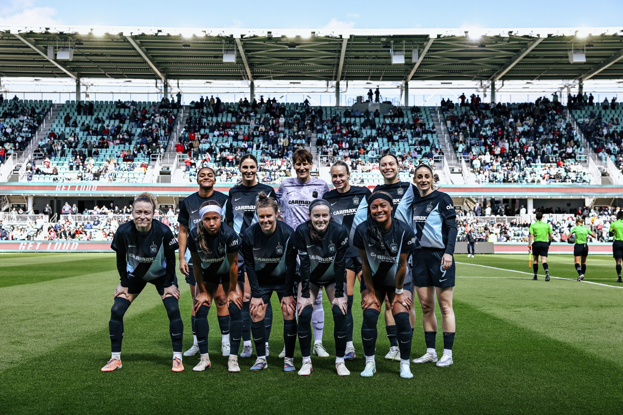 Gotham FC players line up before the match.