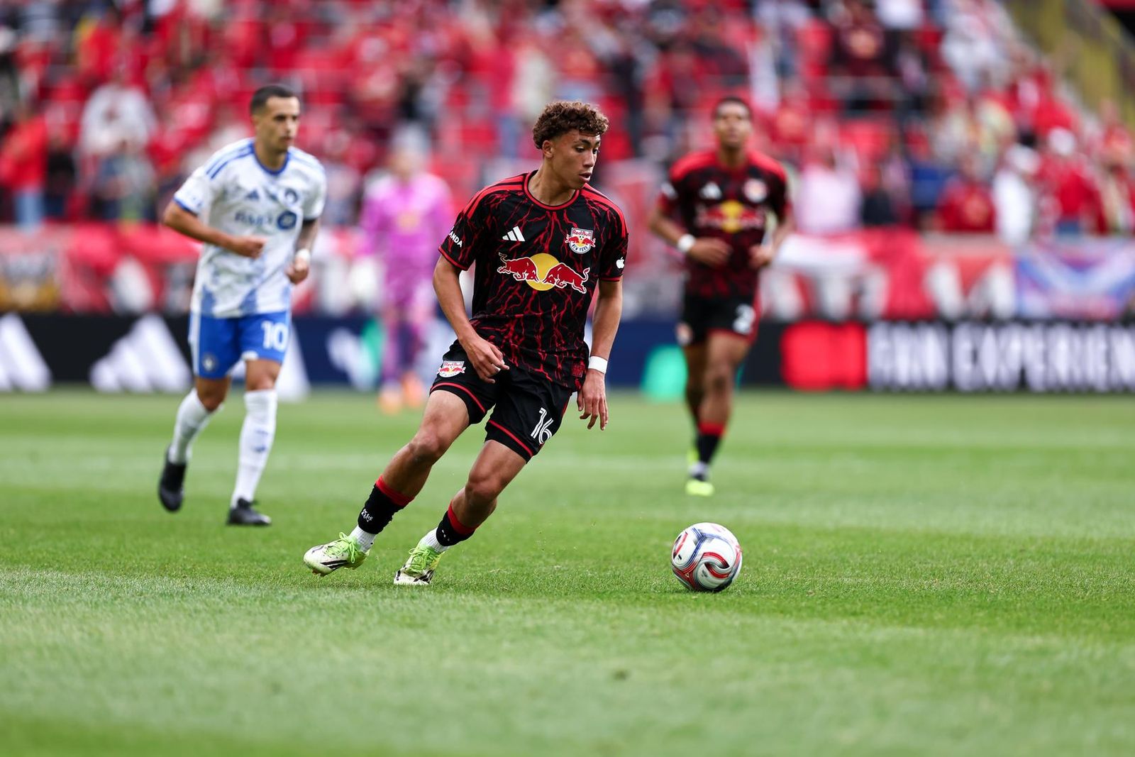 Red Bull New York forward Julian Hall runs with the ball.