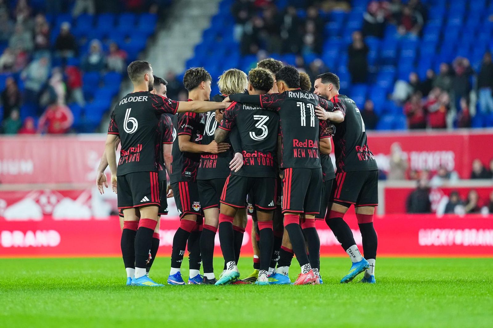 Red Bull New York players celebrate together.
