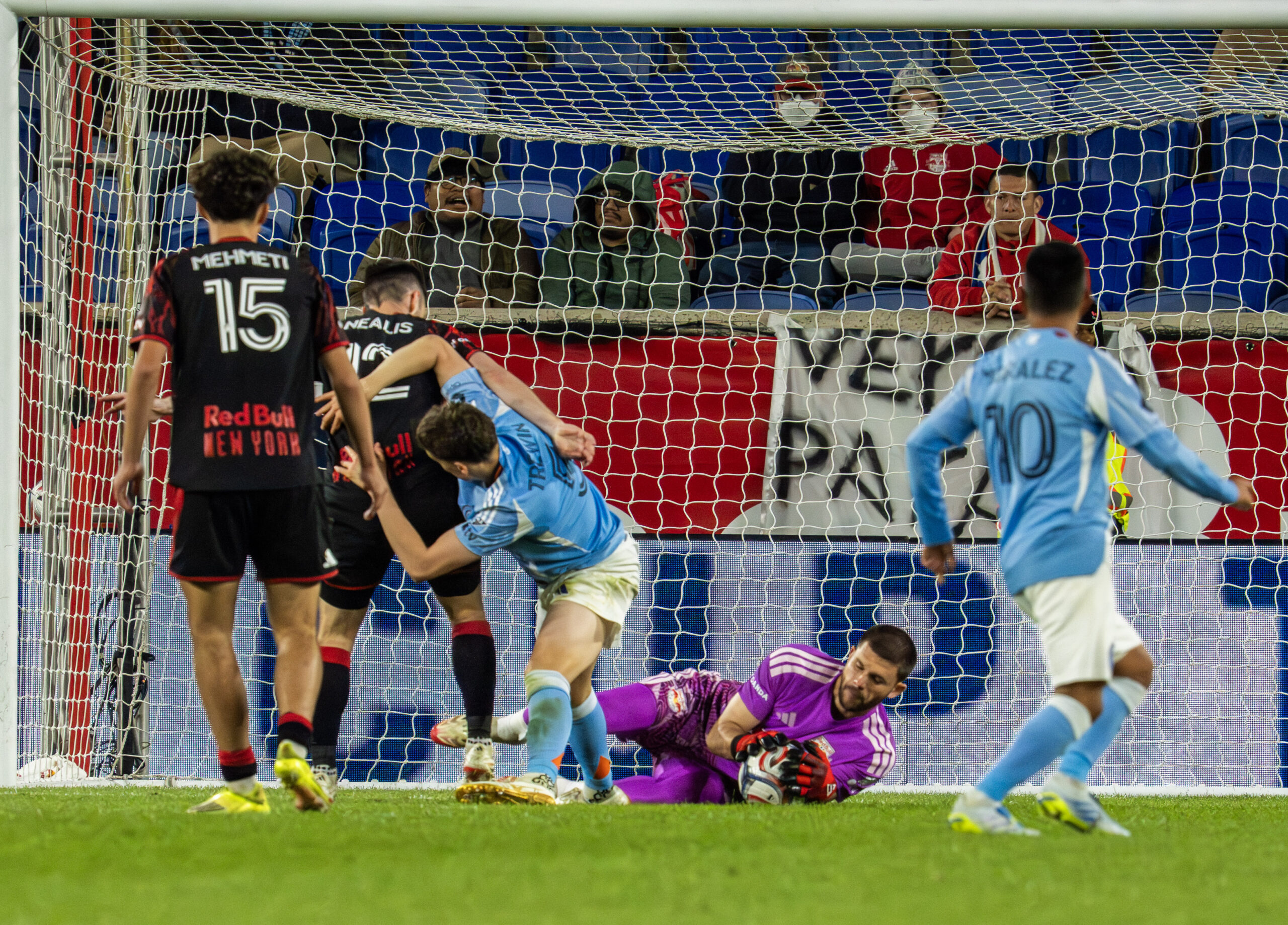 Red Bull New York players defend against New York City FC.