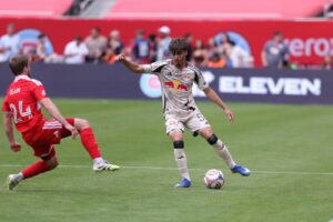 Red Bull New York defender Matthew Dos Santos performs a dribble.