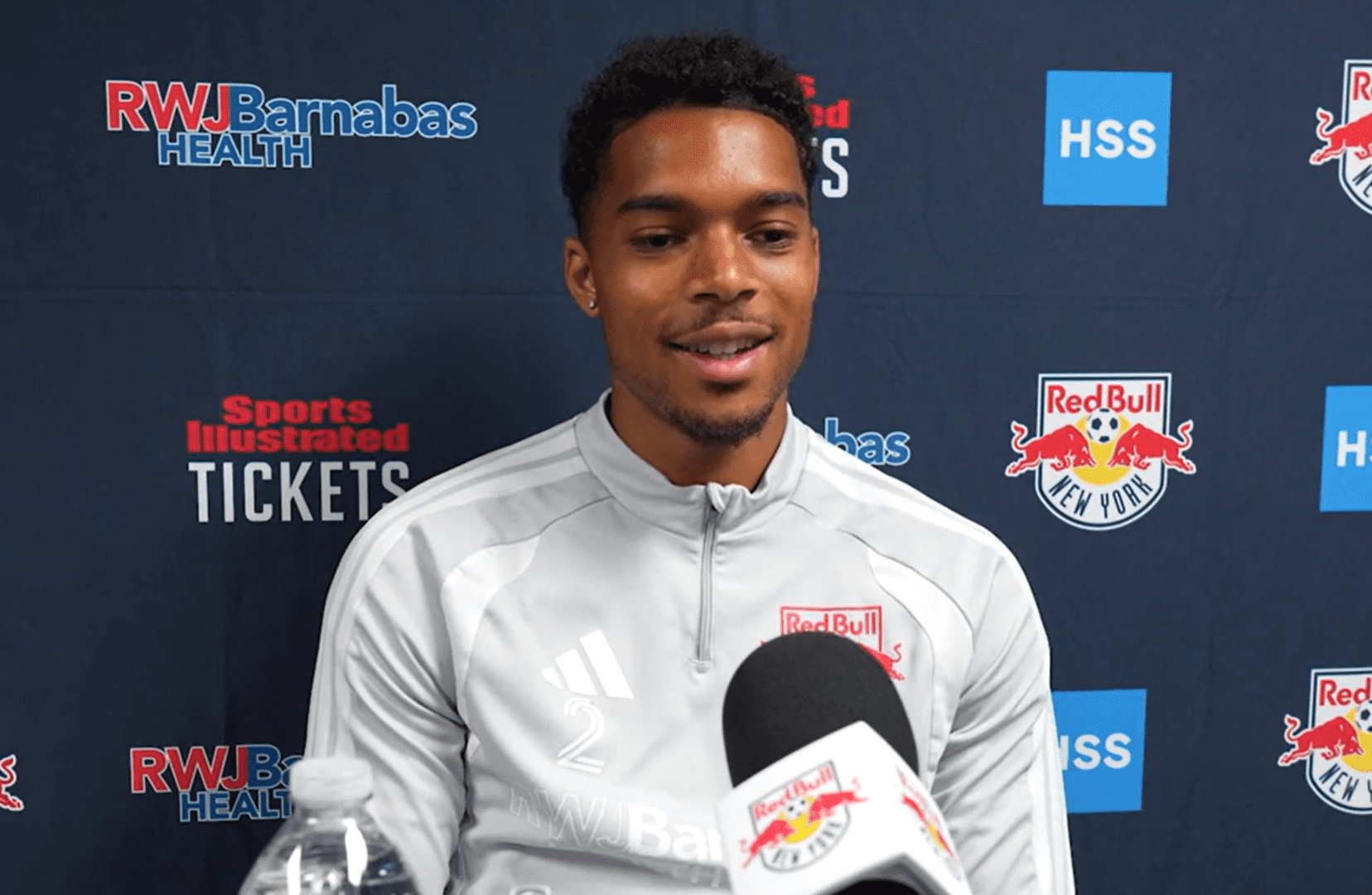 Red Bull New York defender Justin Che speaks to the media.