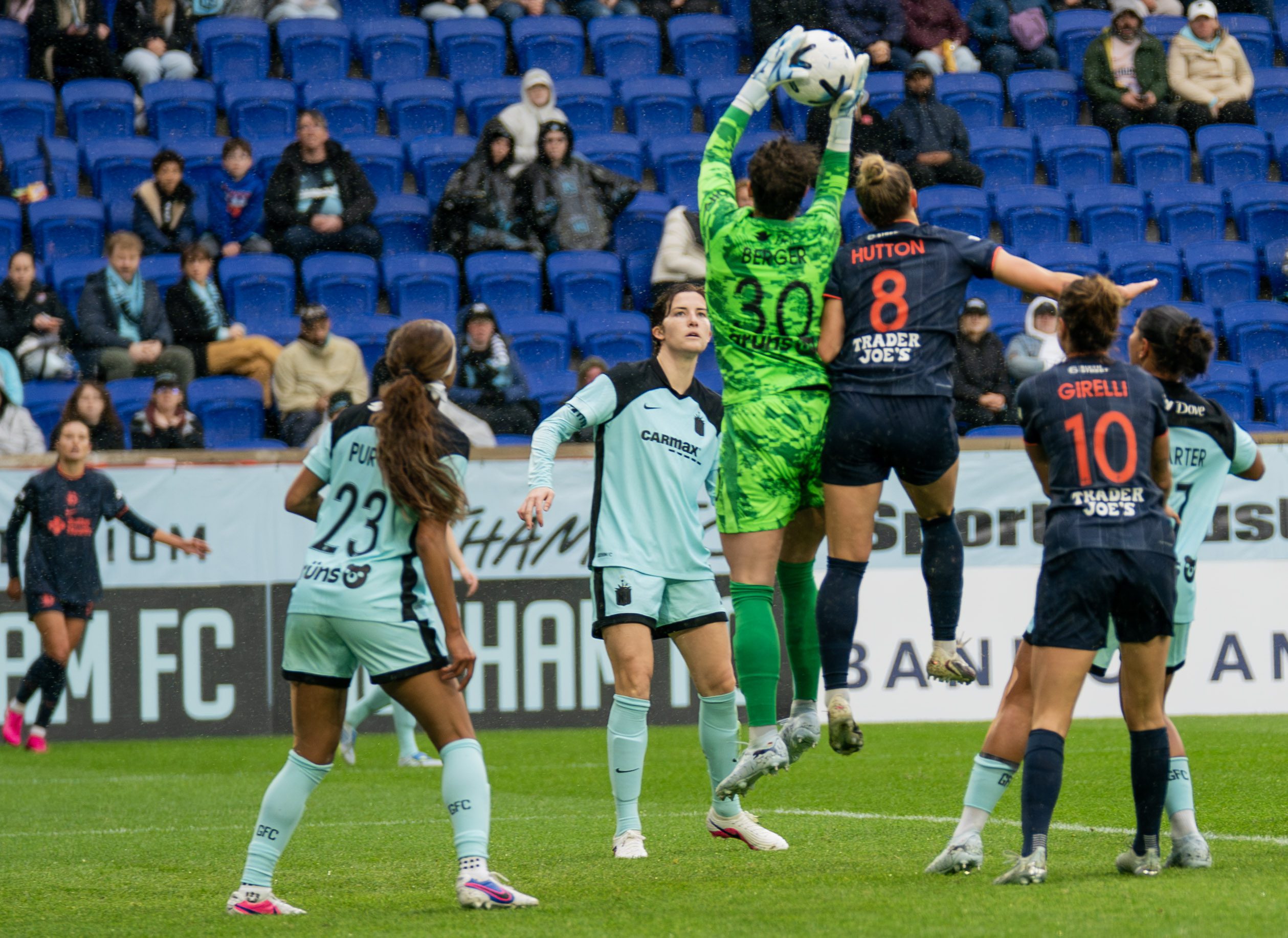 Gotham FC goalkeeper Ann-Katrin Berger rises to collect the ball.