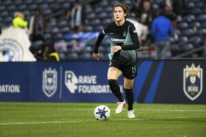 Gotham FC captain Tierna Davidson runs with the ball.