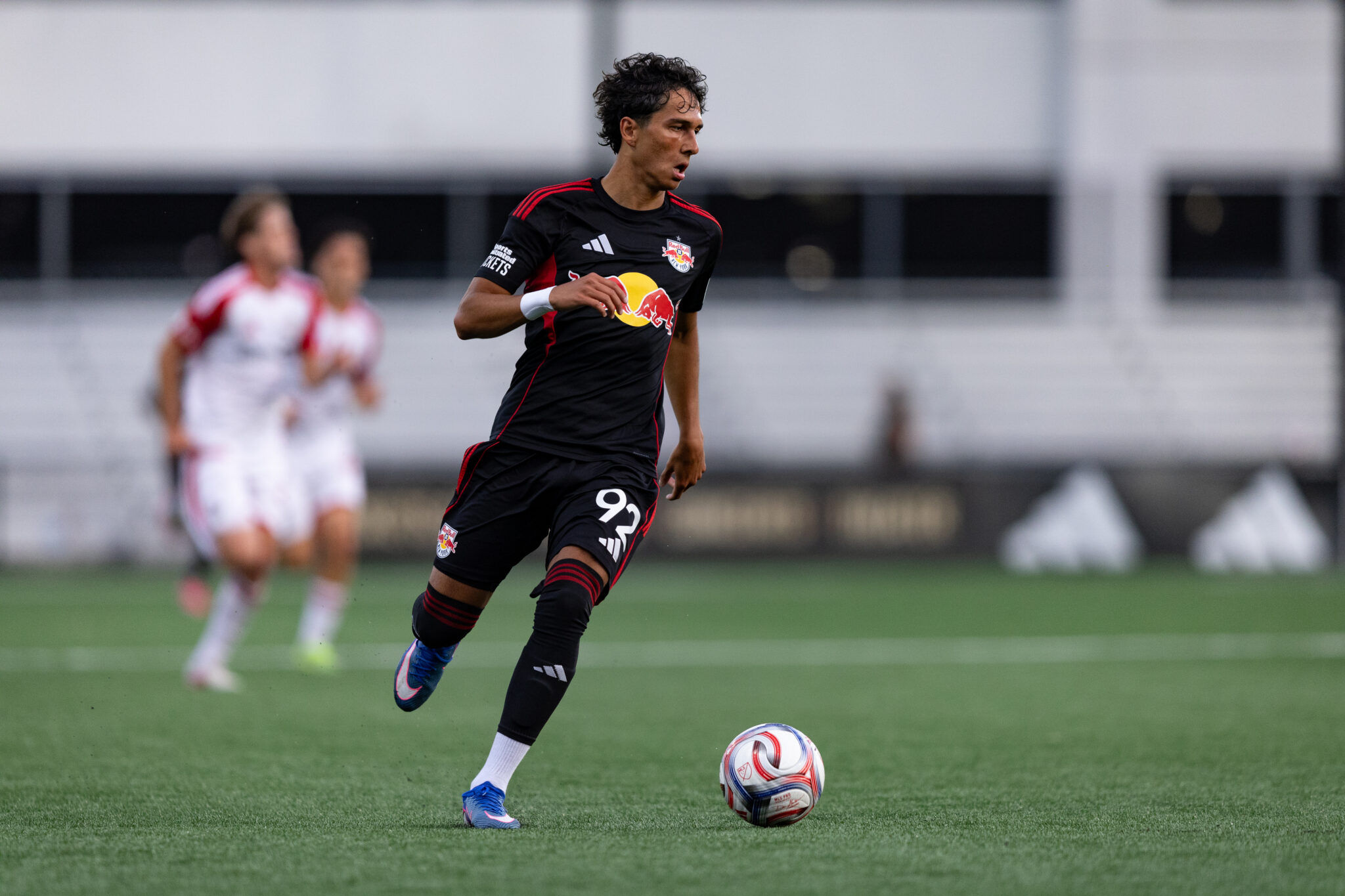 Red Bull New York II forward Dennis Nelich advances the ball.