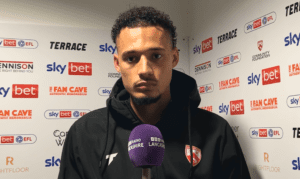 Rhys Williams speaks to reporters.