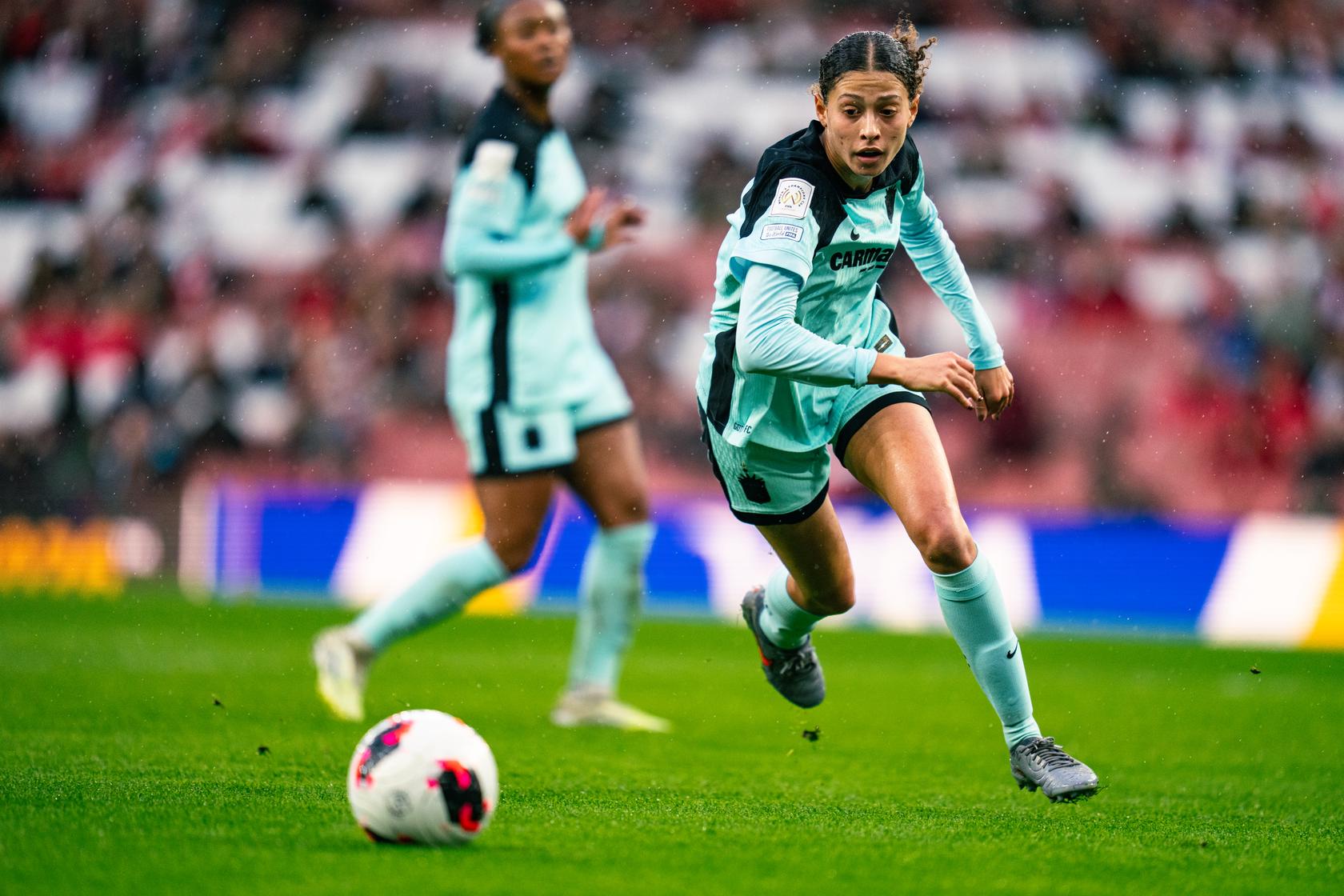 Gotham FC midfielder Sofia Cook chases after the ball.