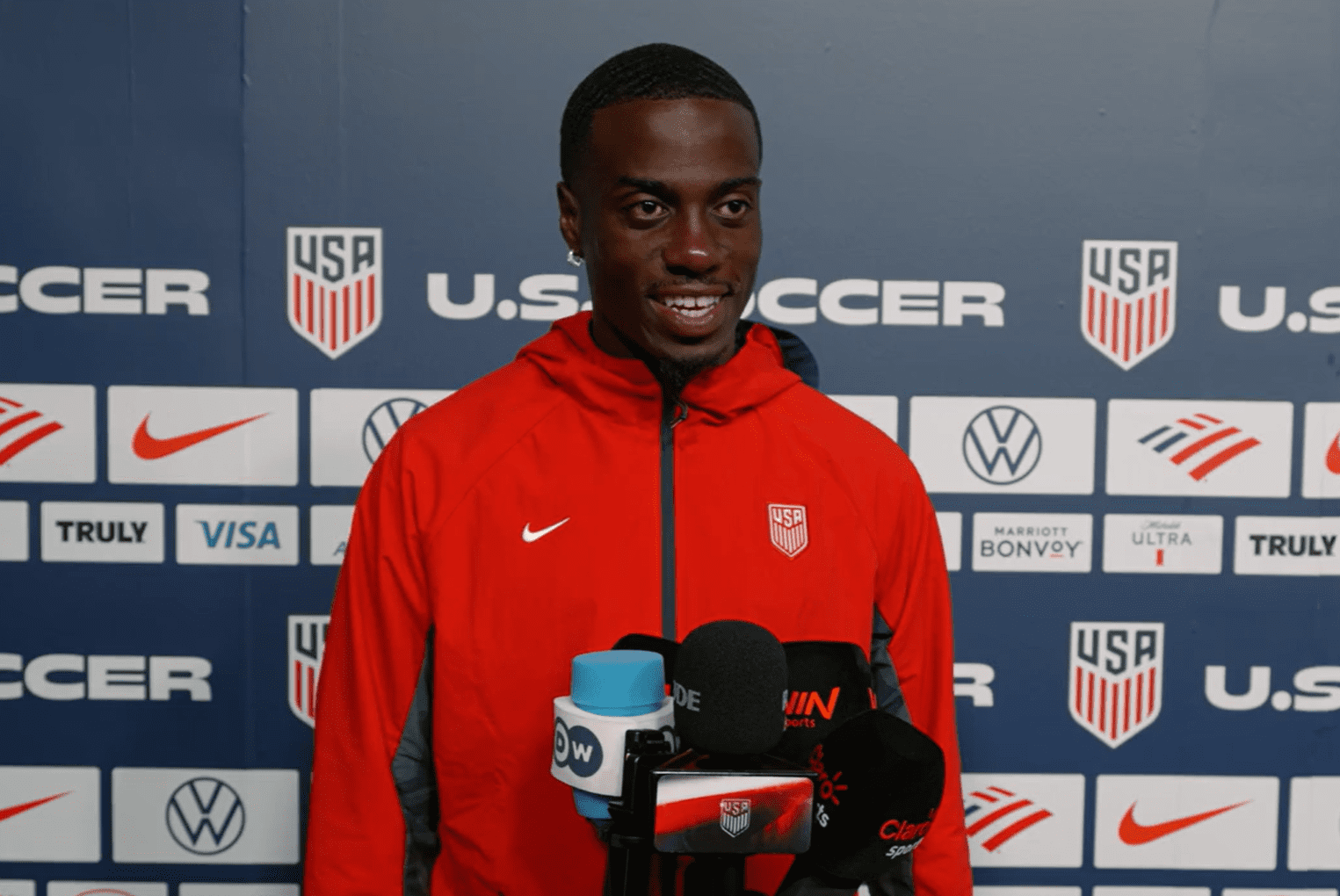 United States national team winger Timothy Weah speaks to reporters.