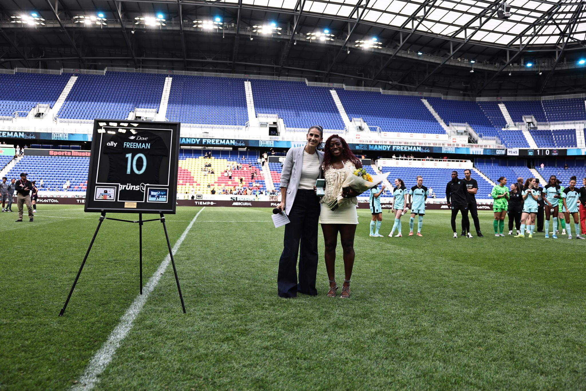 Gotham FC defender Mandy Freeman is honored by general manager Yael Averbuch West for her 10 years at the club.