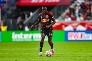 Red Bull New York defender Julián Bazán dribbles the ball against Charlotte FC during the second half at Sports Illustrated Stadium.