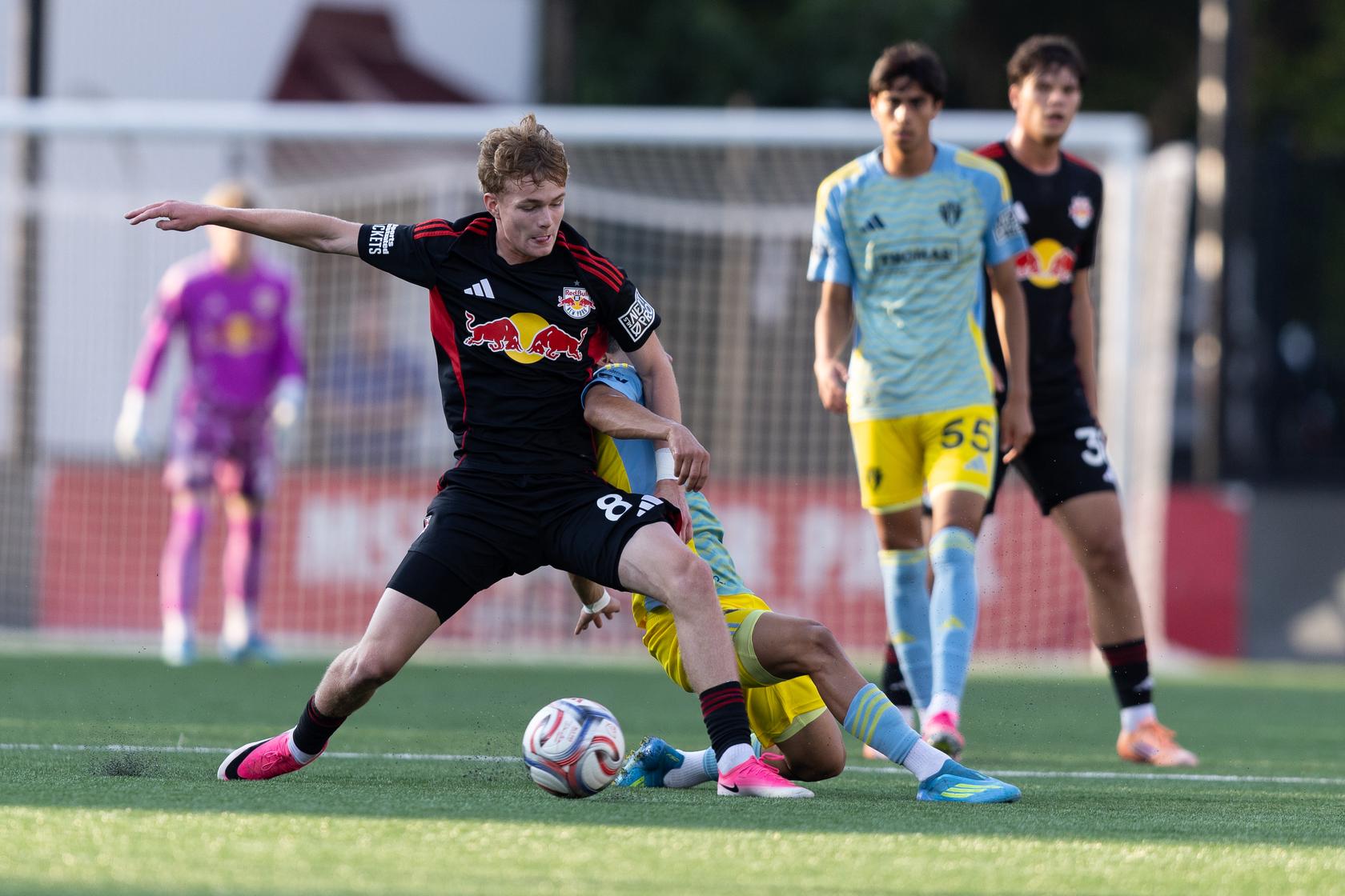 Red Bull New York II winger Benny Rodriguez shields the ball during an MLS NEXT Pro match.