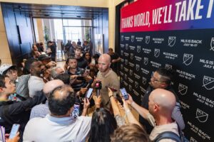 Red Bull New York head coach Michael Bradley speaks to the media during a scrum.