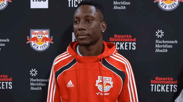 Red Bull New York midfielder Ronald Donkor is interviewed by reporters following a match.