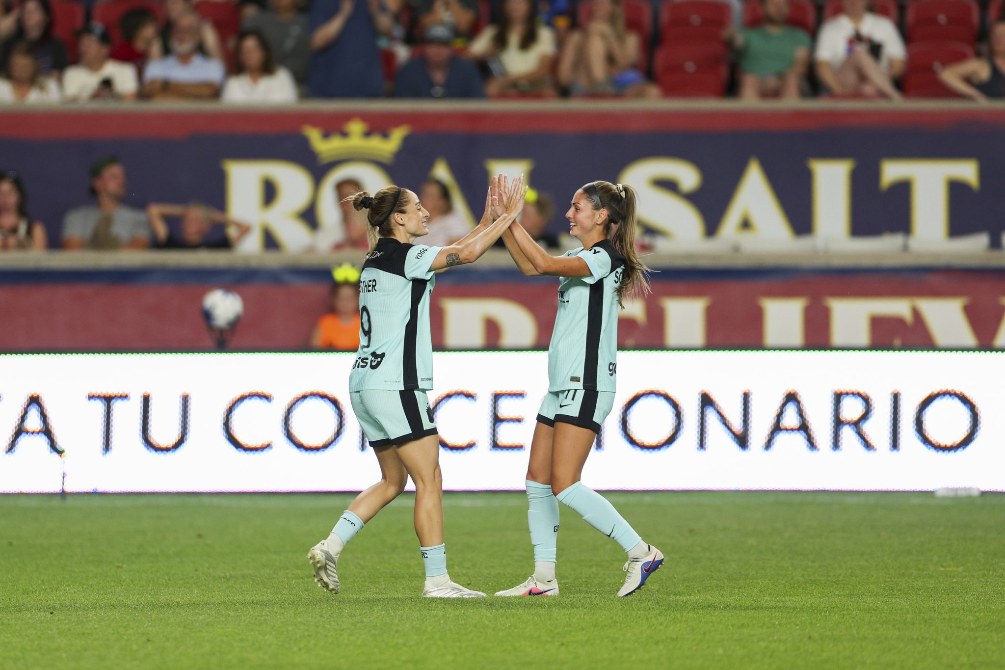 Gotham FC teammates Esther González and Sarah Schupansky celebrate together.