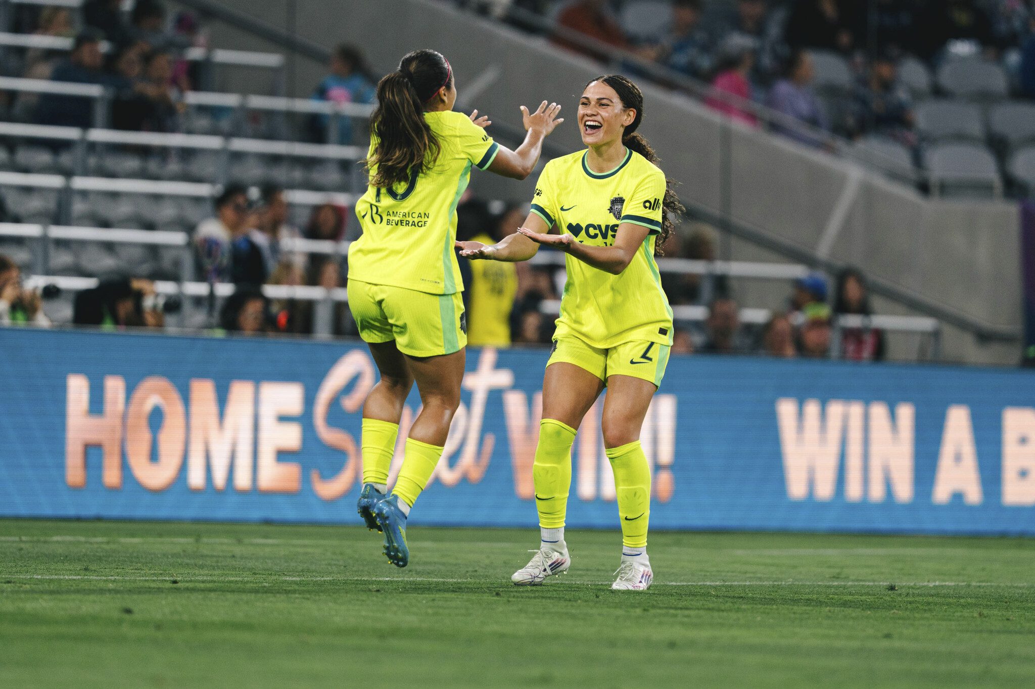 Washington Spirit teammates Leicy Santos and Trinity Rodman celebrate together.