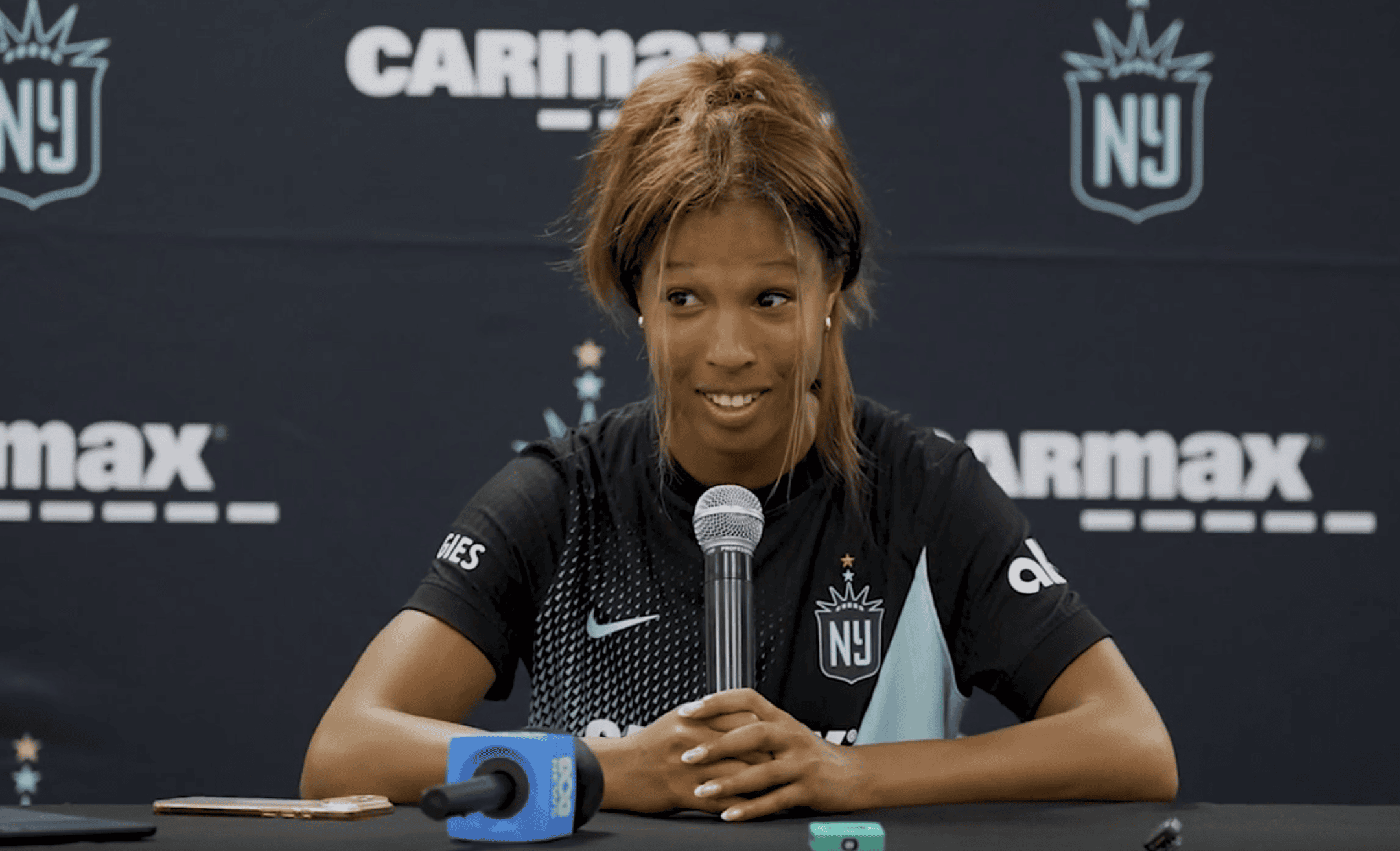 Gotham FC forward Midge Purce speaks during a press conference.