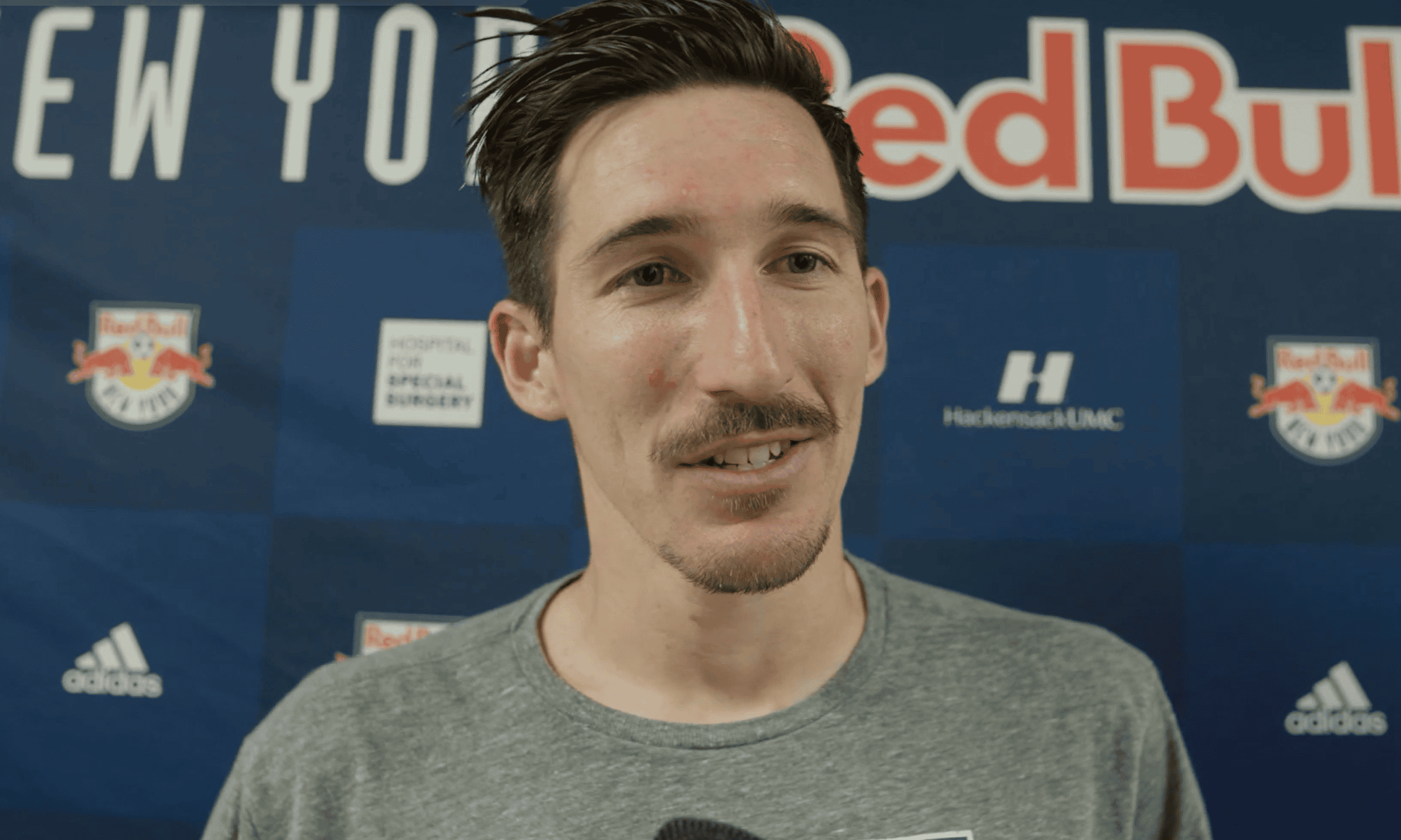 Red Bull New York midfielder Sacha Kljestan speaks to reporters.