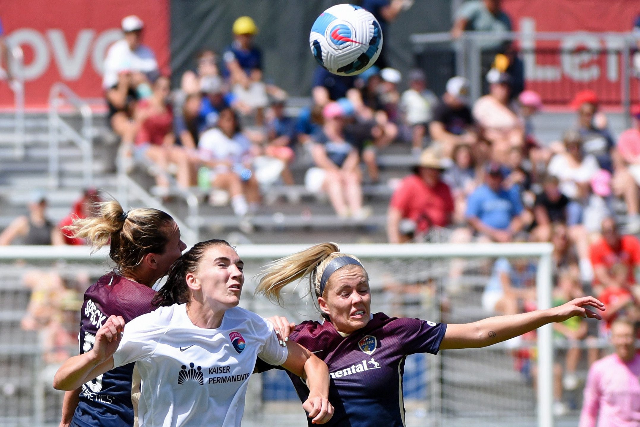 San Diego Wave FC midfielder Taylor Kornieck battles for a header against North Carolina Courage midfielder Meredith Speck and midfielder Denise O'Sullivan during the second half at WakeMed Soccer Park.