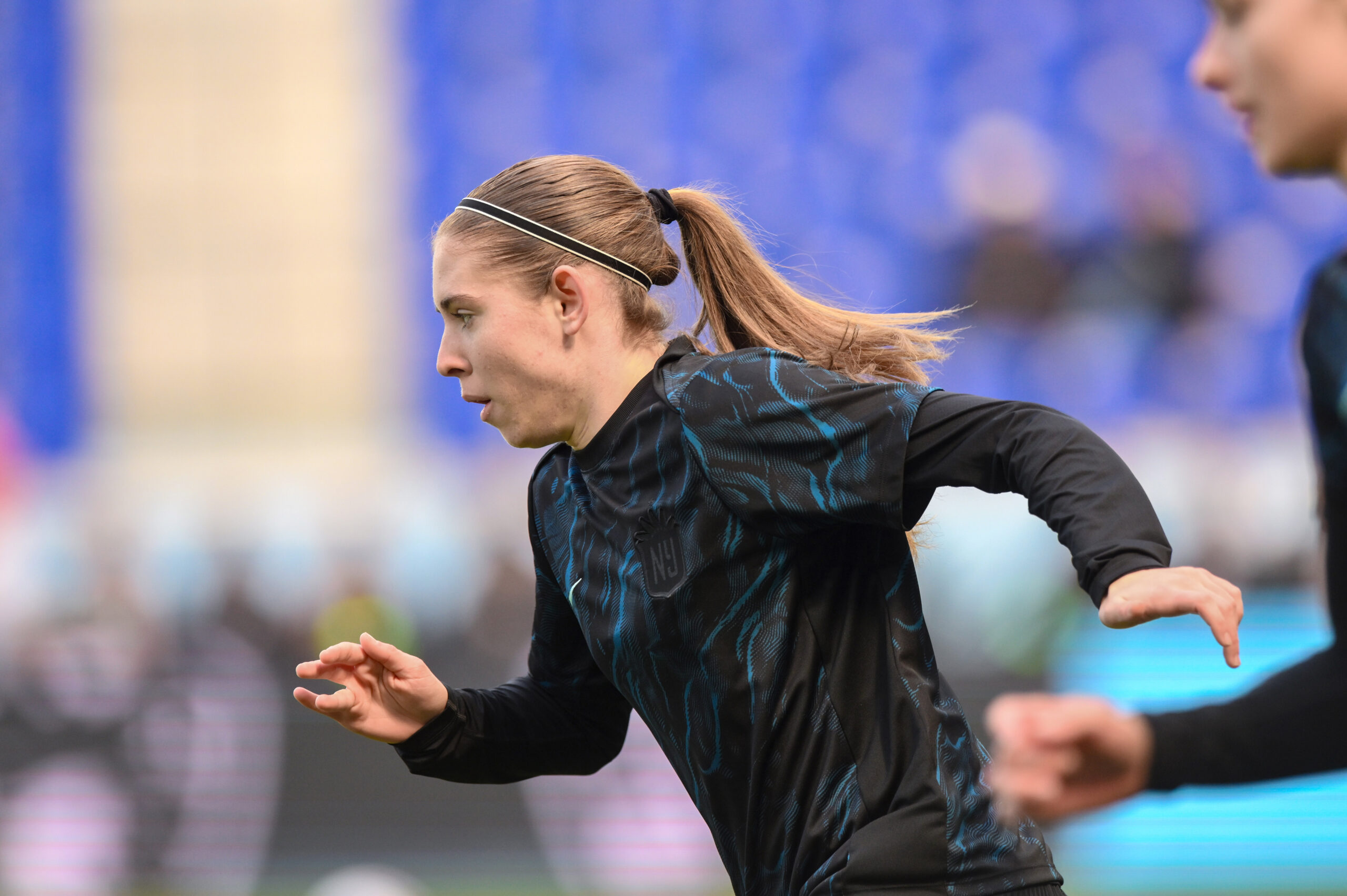 Gotham FC forward Mak Whitham warms up before an NWSL match.