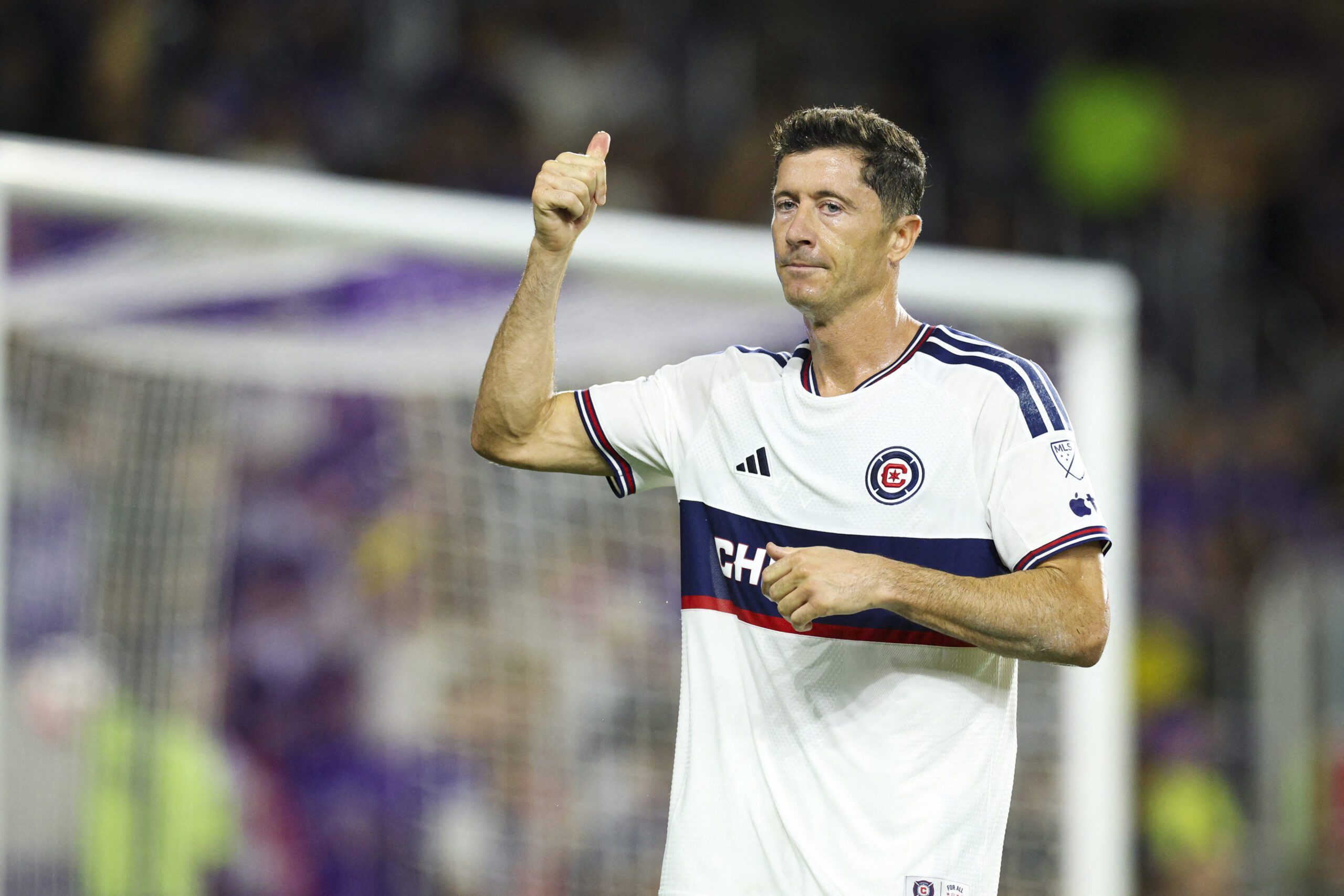 Chicago Fire forward Robert Lewandowski reacts after scoring.