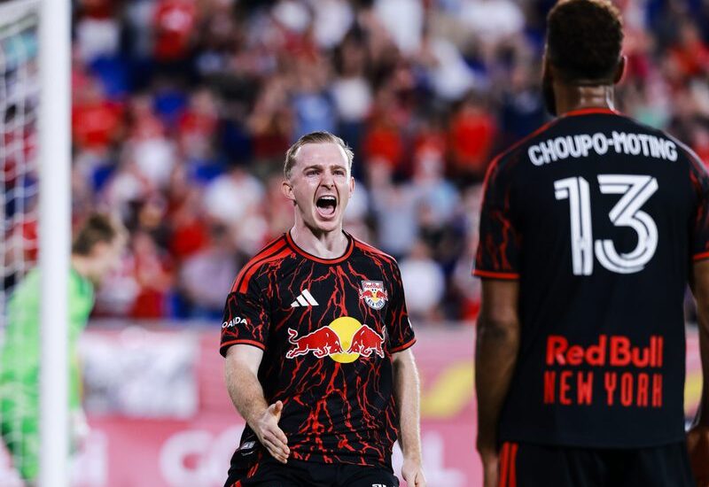 Red Bull New York teammates Cameron Harper and Eric Maxim Choupo-Moting celebrate together.