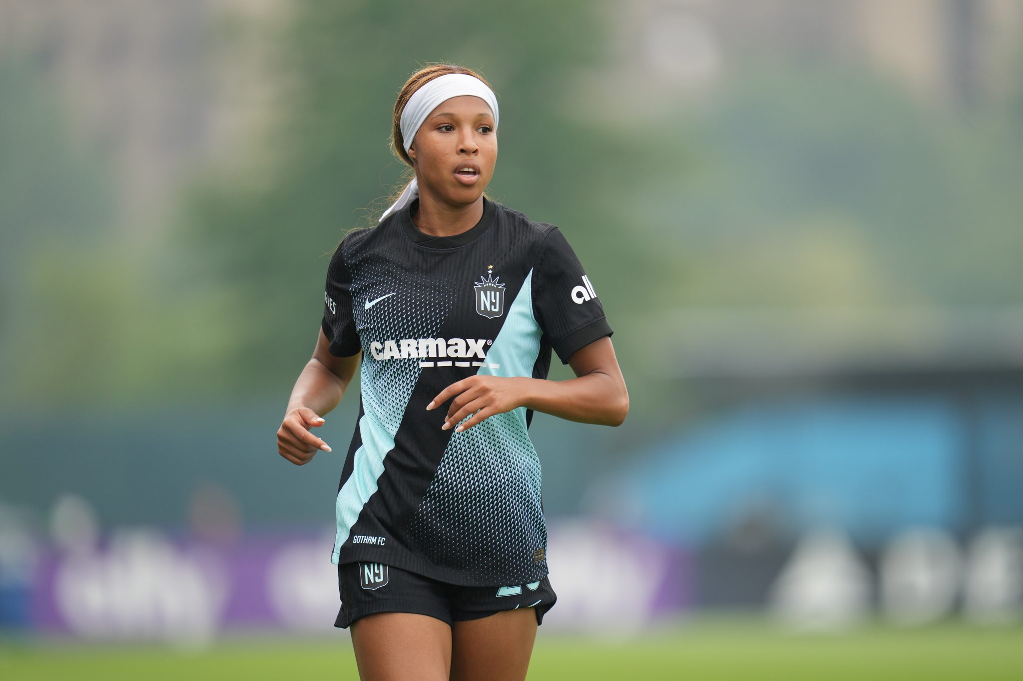 Gotham FC forward Midge Purce looks on.