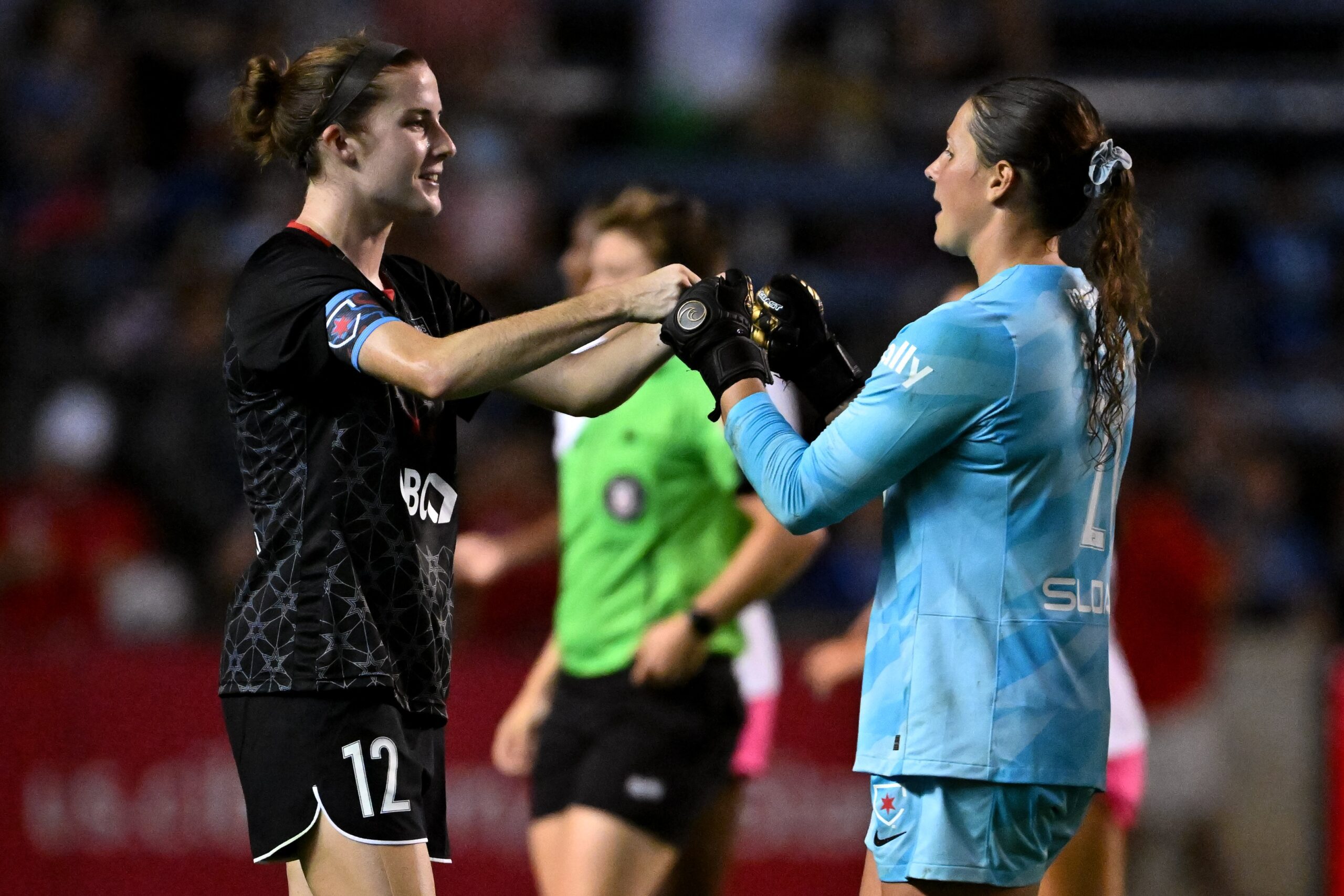Chicago Red Stars defender Tierna Davidson celebrates with goalkeeper Emily Boyd at SeatGeek Stadium.