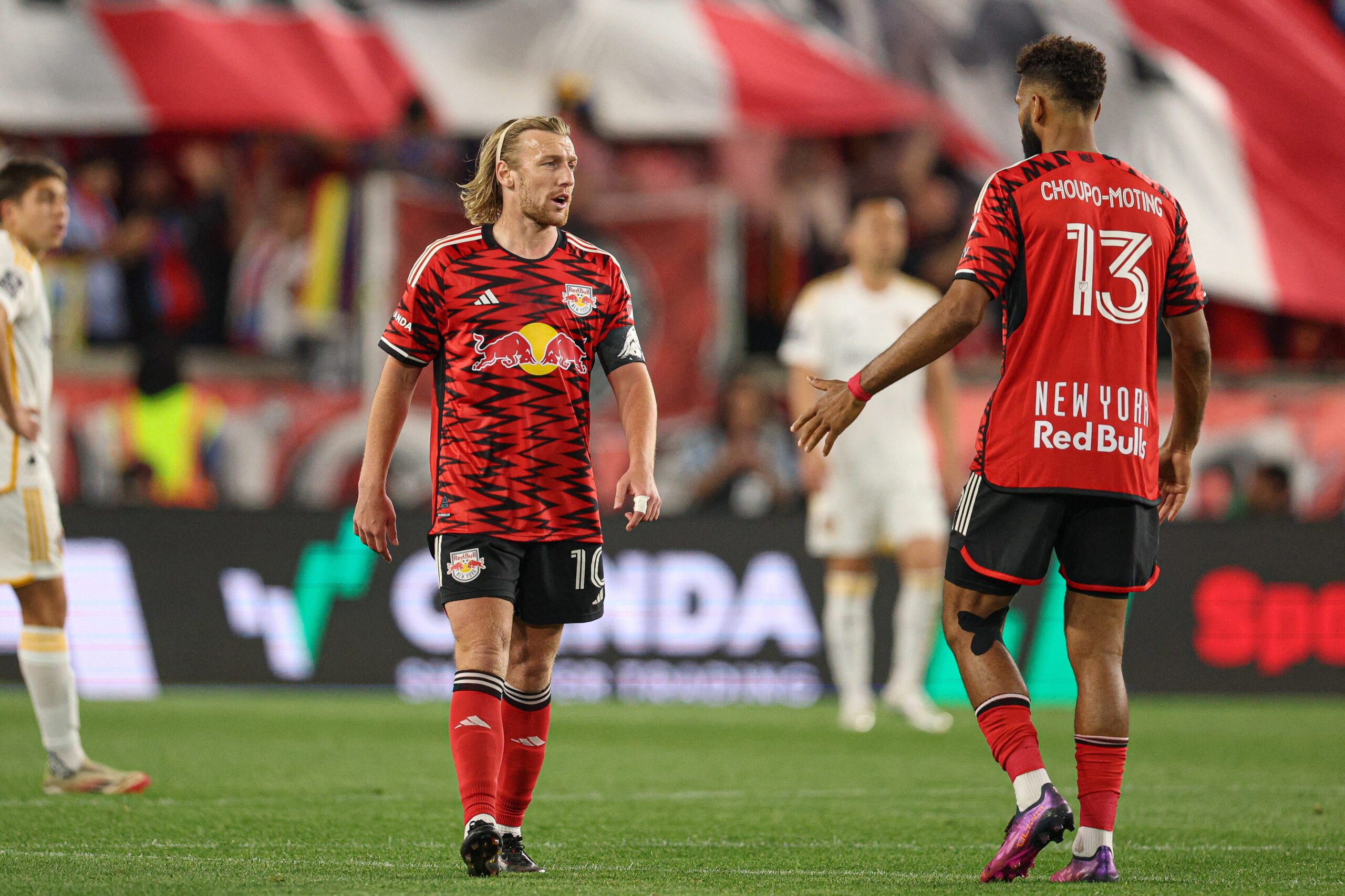 Red Bull New York midfielder Emil Forsberg and forward Eric Maxim Choupo-Moting in action at Sports Illustrated Stadium.