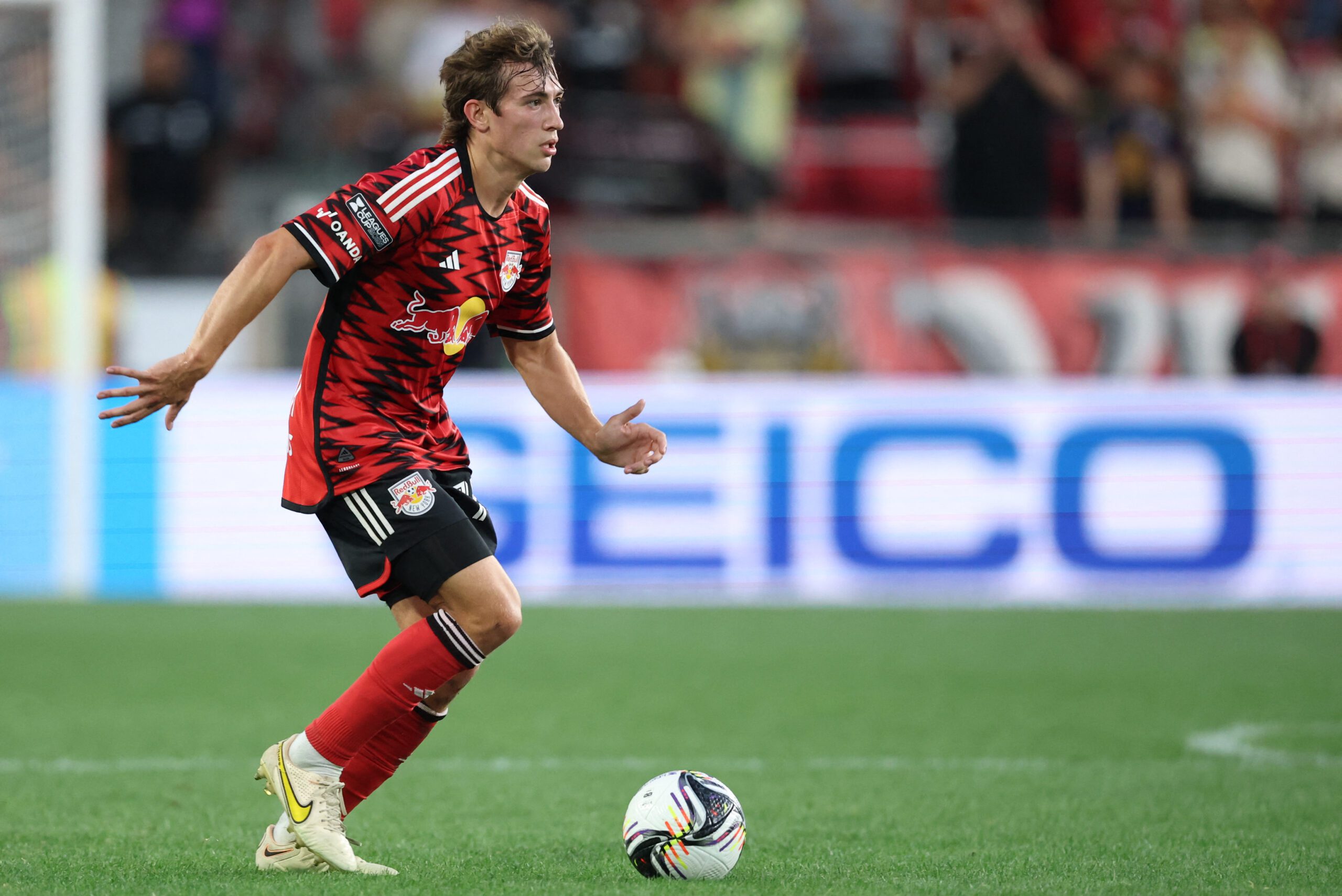 Red Bull New York midfielder Daniel Edelman controls the ball.