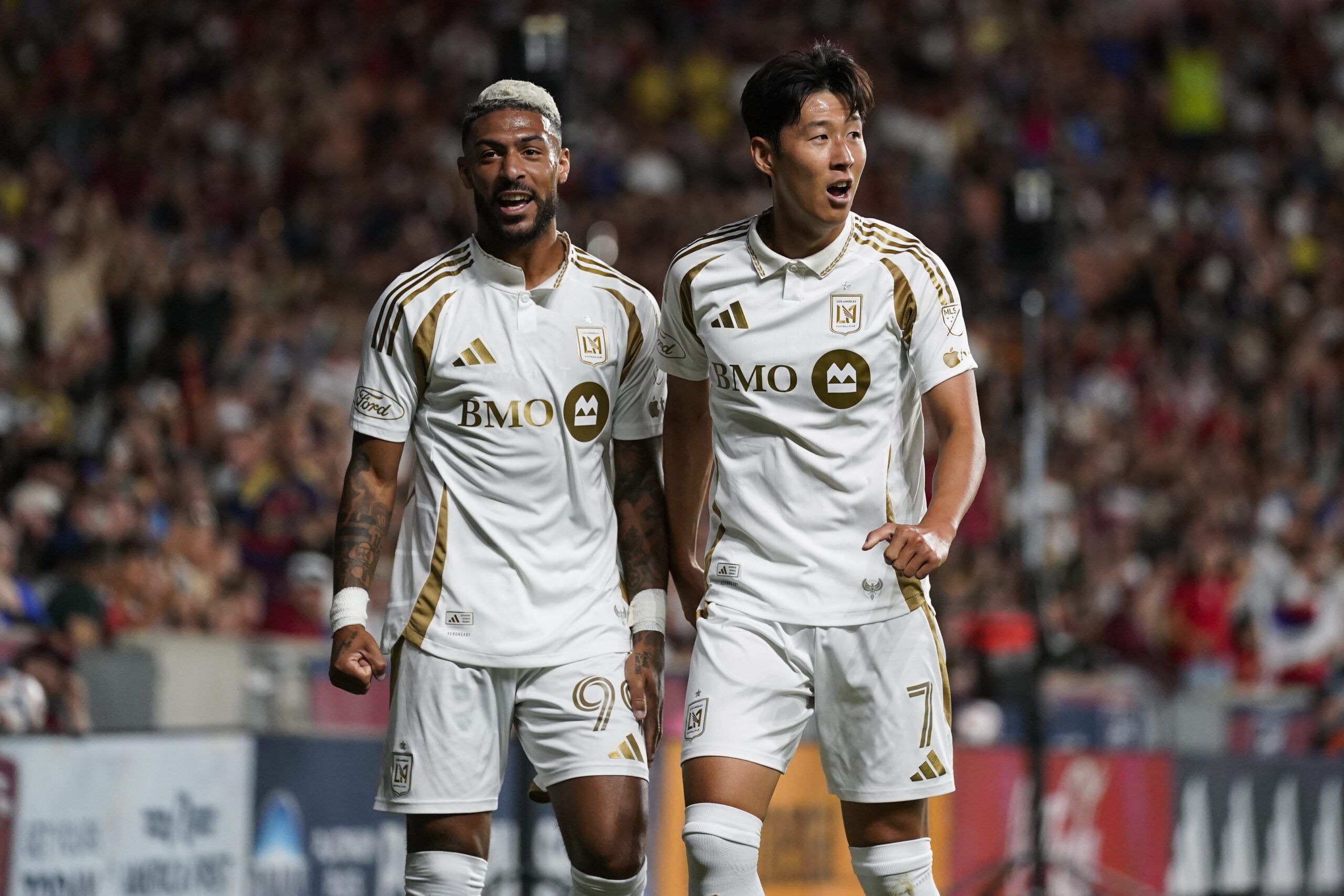 Los Angeles FC forward Son Heung-Min celebrates a first half goal with Los Angeles FC forward Denis Bouanga against Real Salt Lake.