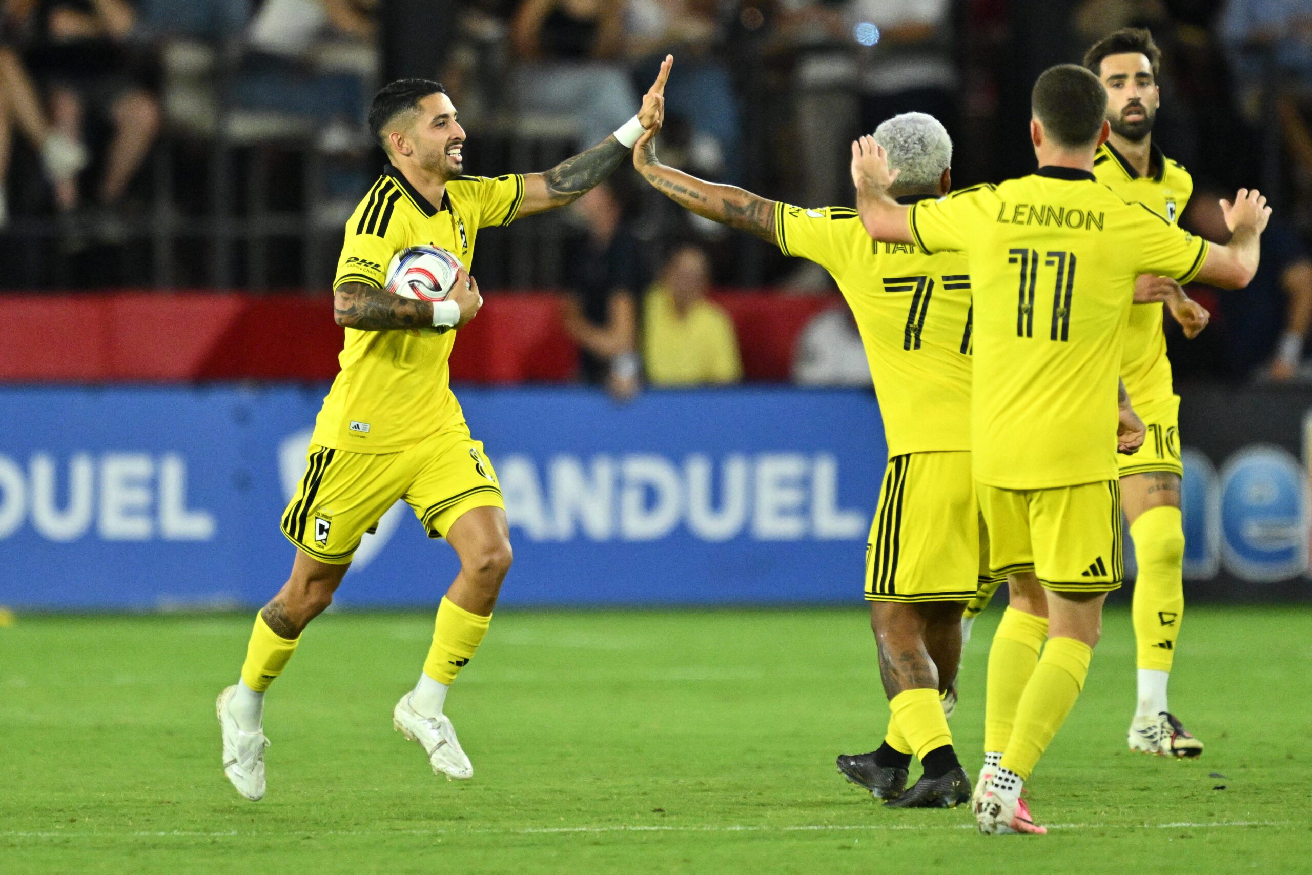 Columbus Crew midfielder Santiago Rodriguez celebrates with forward Josef Martinez.