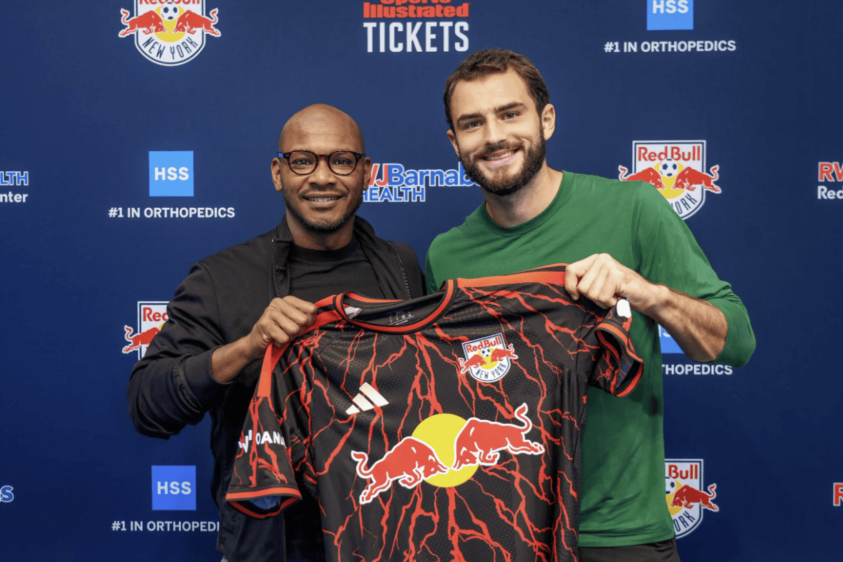 Red Bull New York defender Devin Padelford poses with the club's head of sport Julian de Guzman.