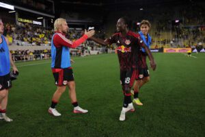 Red Bull New York midfielder Ronald Donkor celebrates with teammates.