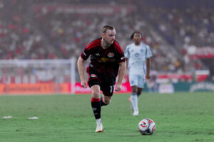 Red Bull New York forward Cameron Harper performs a dribble.