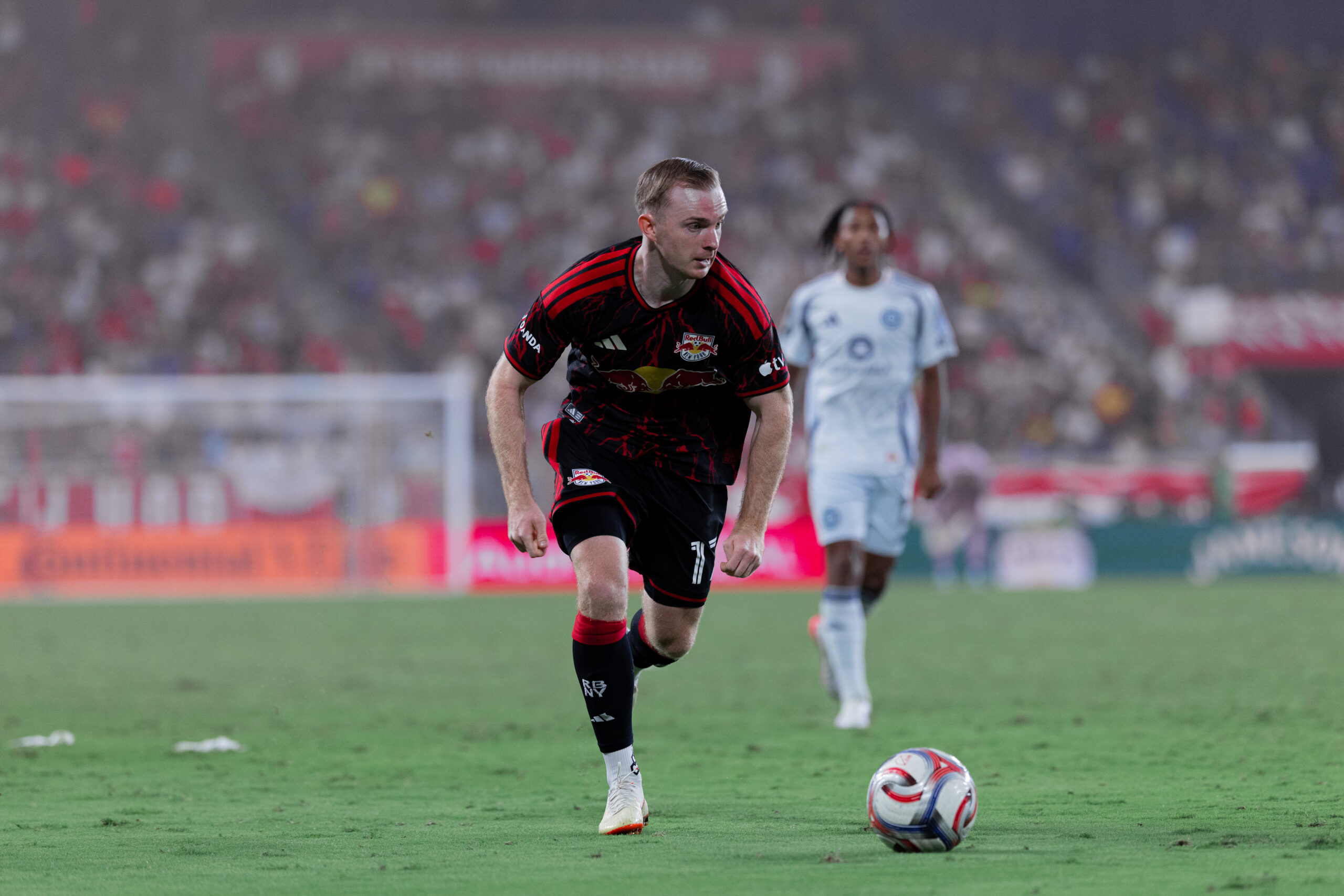 Red Bull New York forward Cameron Harper performs a dribble.