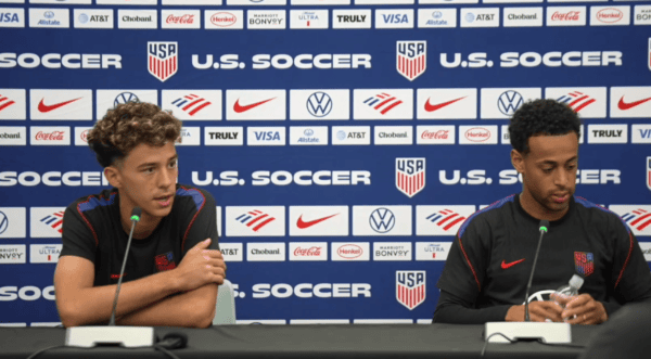 United States men's national team players speak during a press conference.