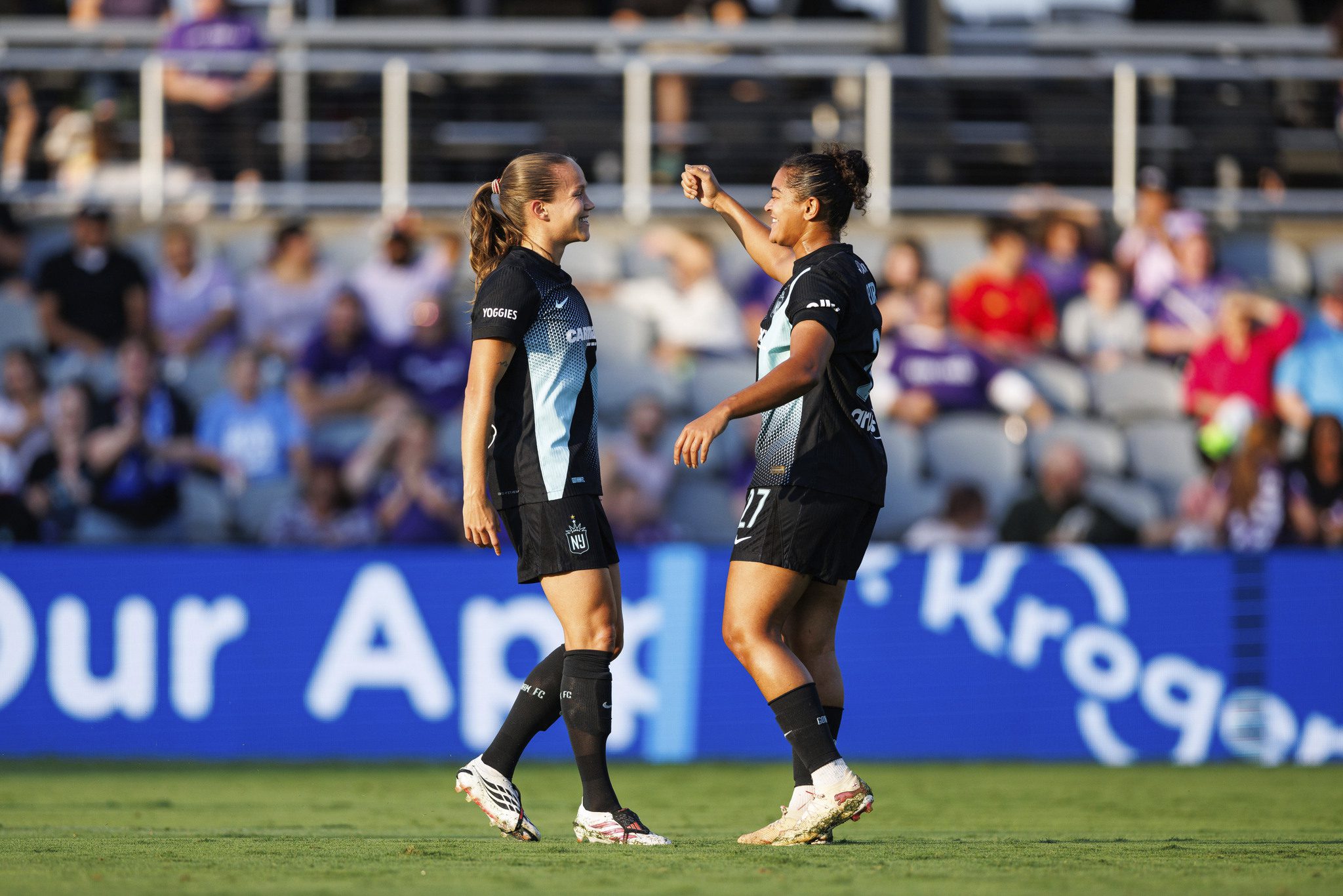 Gotham FC defenders Guro Reiten and Jess Carter celebrate together.